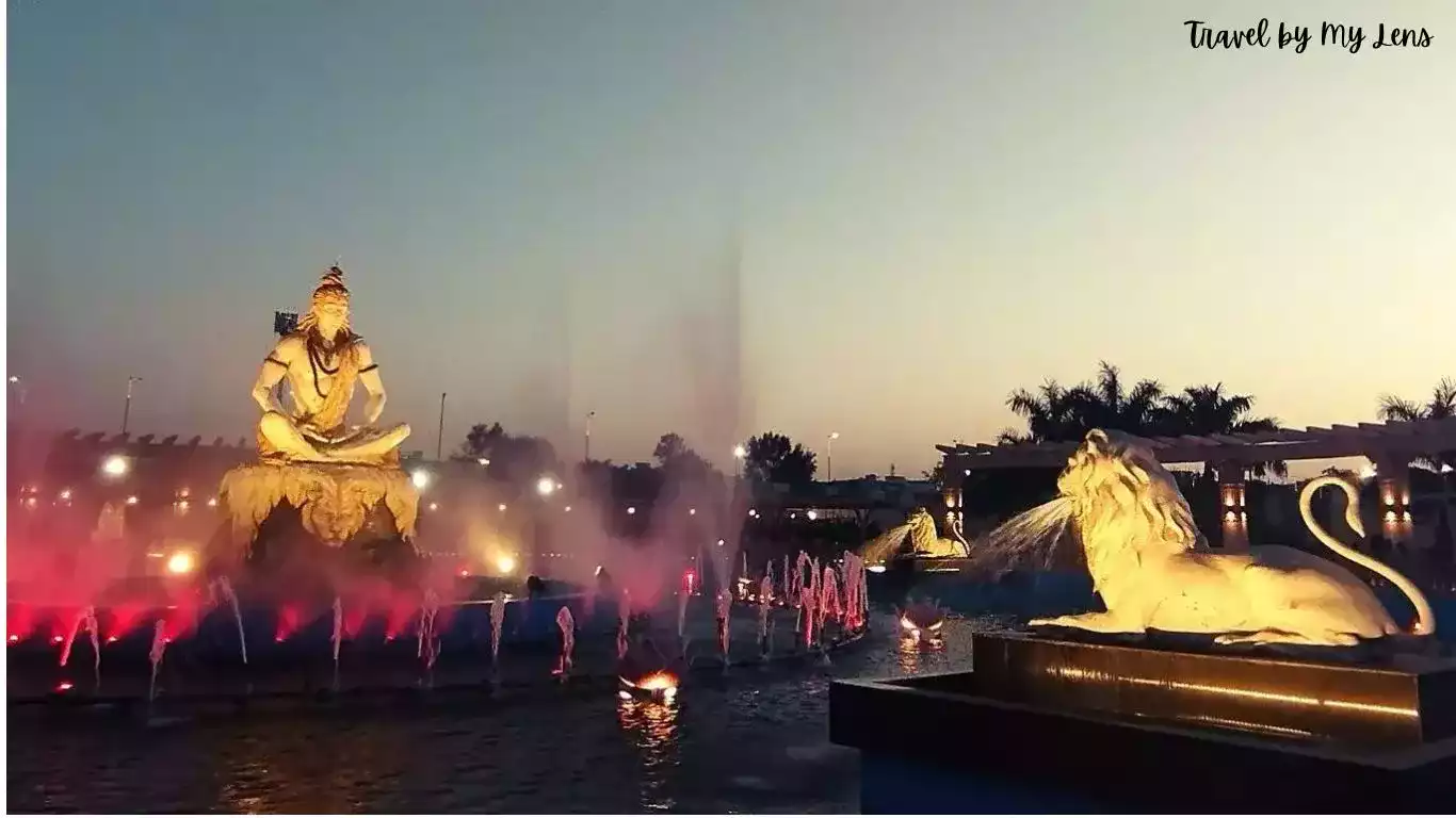 A big Lotus pond in the centre of the campus with water fountain, lighting and big Shiva statue in Mahakal Lok Corridor, Ujjain, M.P., India.