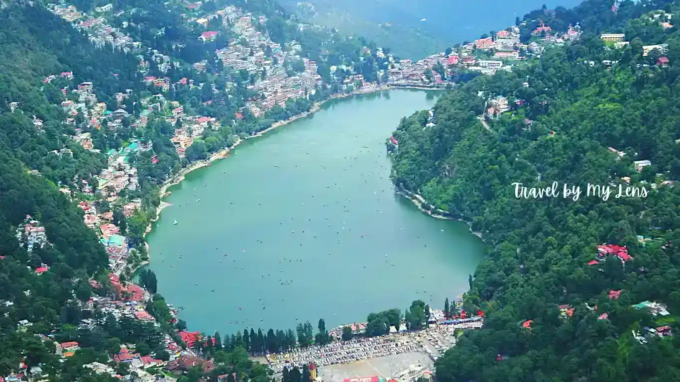 Naini Lake, The centre of Nainital, is surrounded by mall road, thandi sadak and lush green trees.