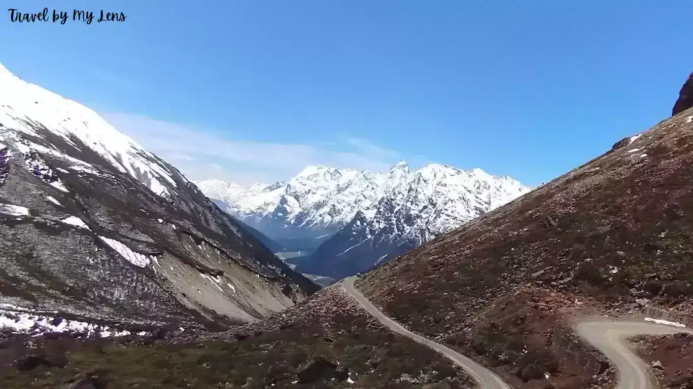 Road to Zero Point from Yumthang Valley, surrounded by beautiful snowy mountain peaks, Lachung, North Sikkim, India