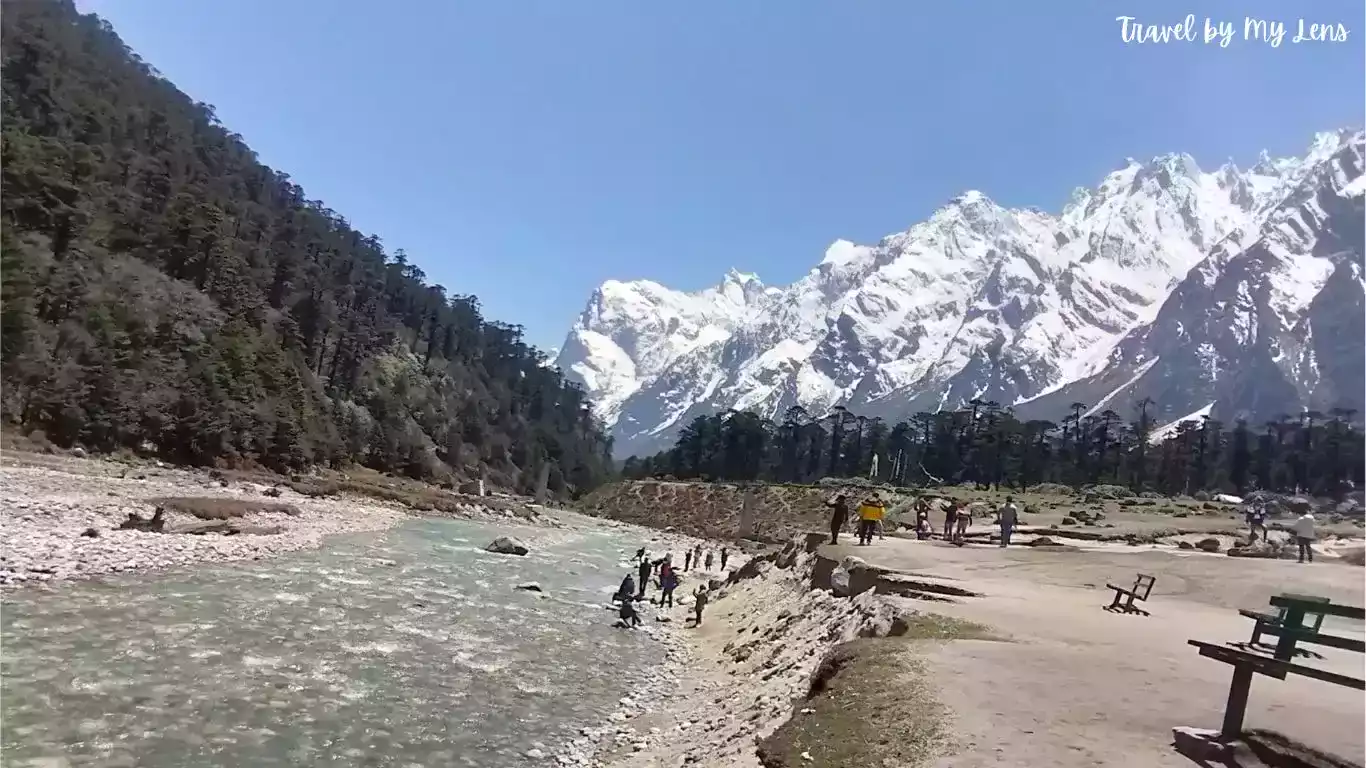 Yumthang River is flowing in Yumthang Valley which is surrounded by snow-clad mountains, Yumthang Valley, Lachung, North Sikkim, India