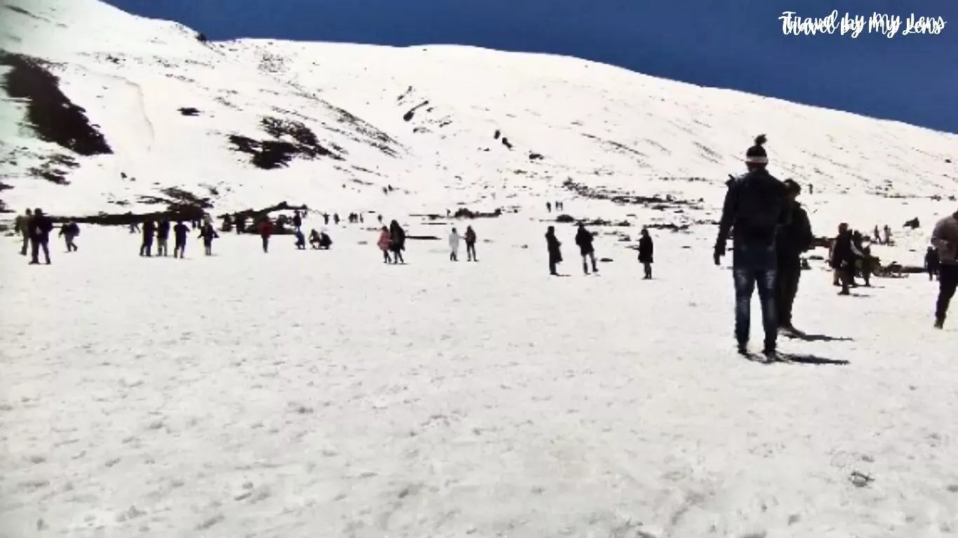 Zero Point is covered with snow. People are playing in the snow at Zero Point, Lachung, North Sikkim, India